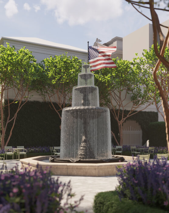 This image depicts a fountain with an American flag outside