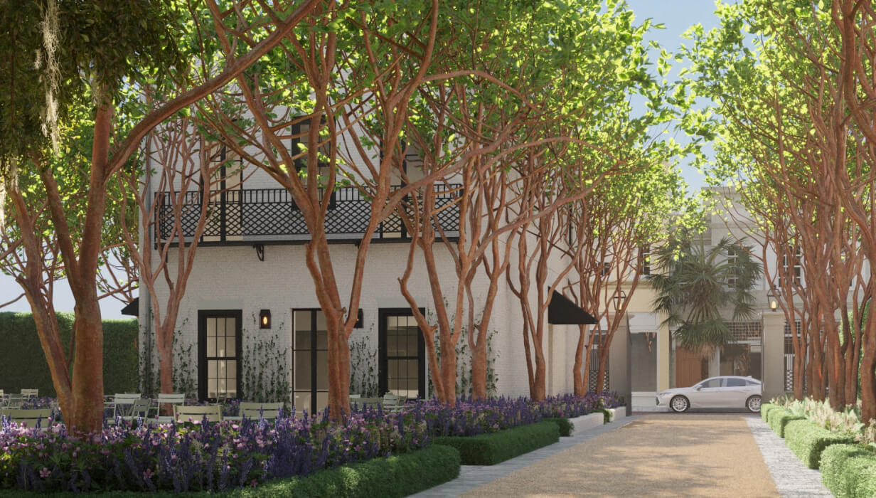 this image depicts a building with outdoor space and tables with chairs + flowers