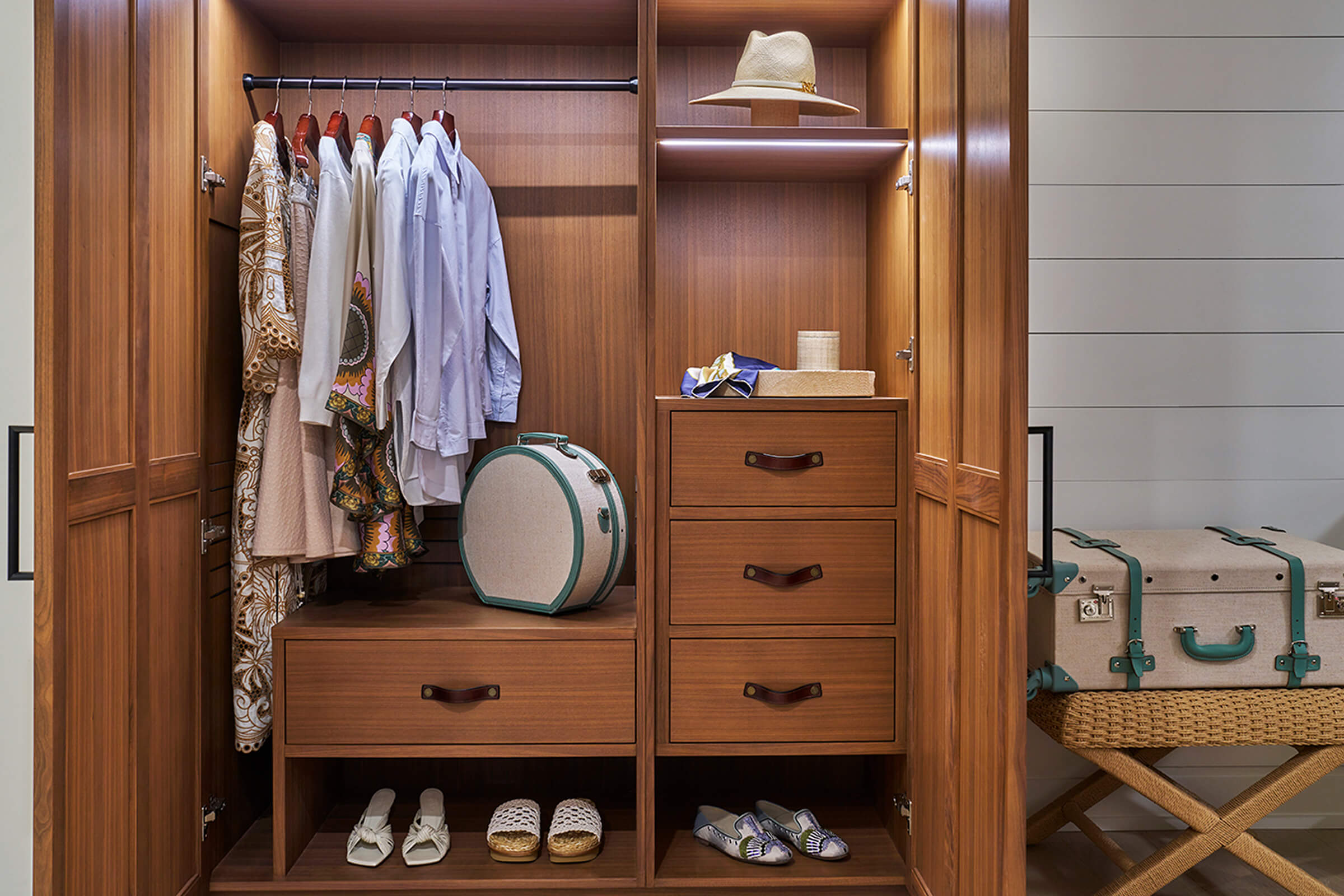 This image depicts a closet with hanging clothes