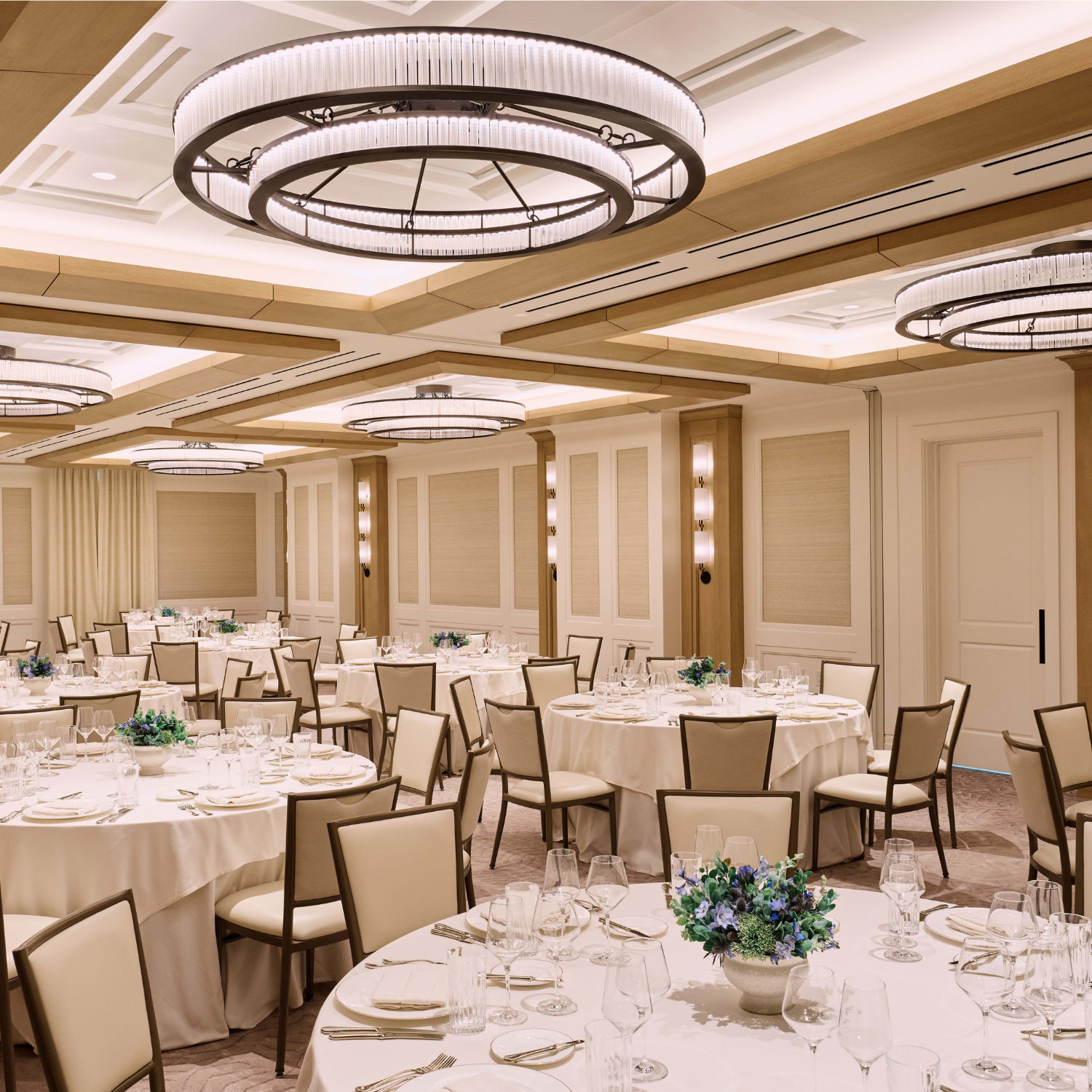 Image of The Salon set up with round tables and chairs