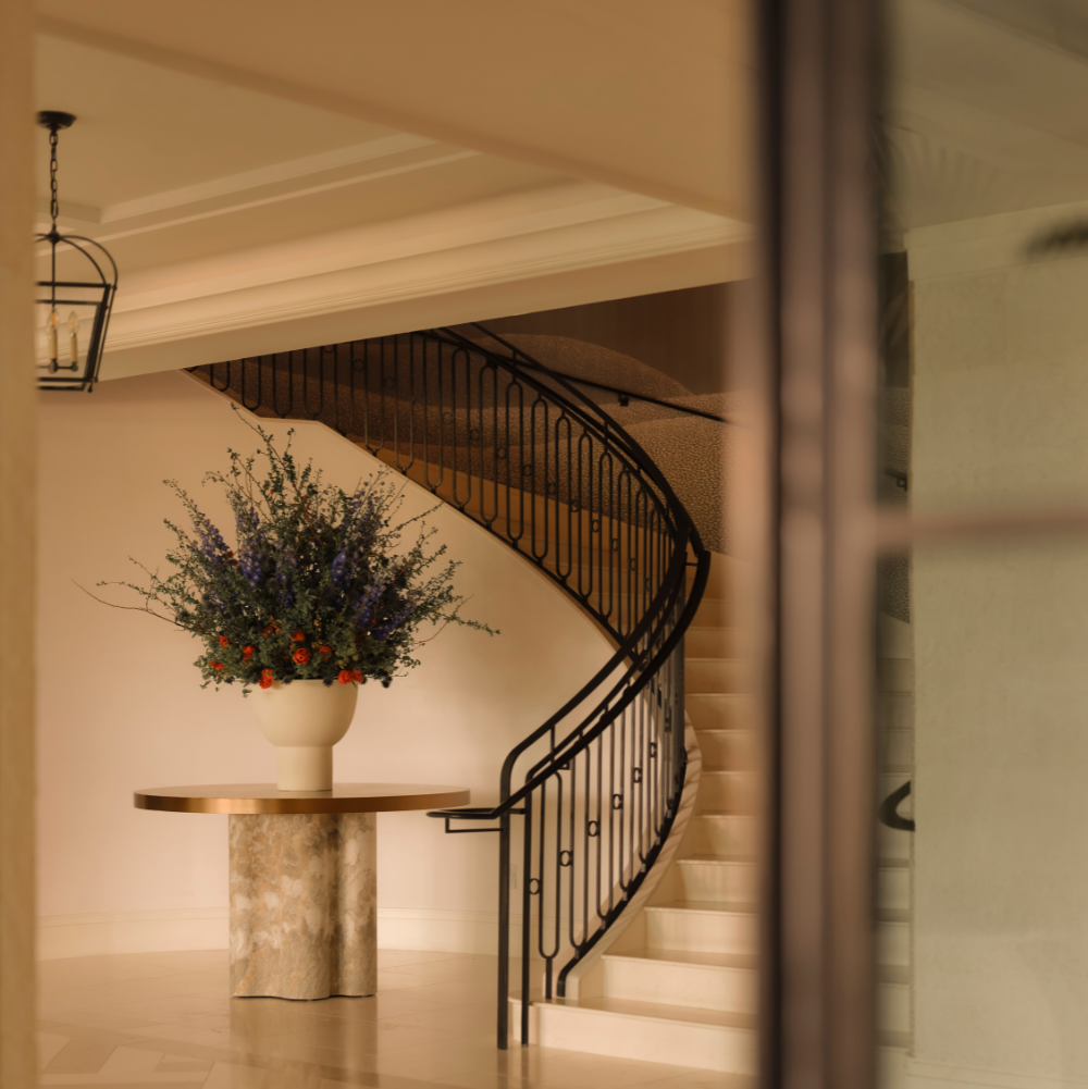 Image of main staircase in the entry of The Cooper