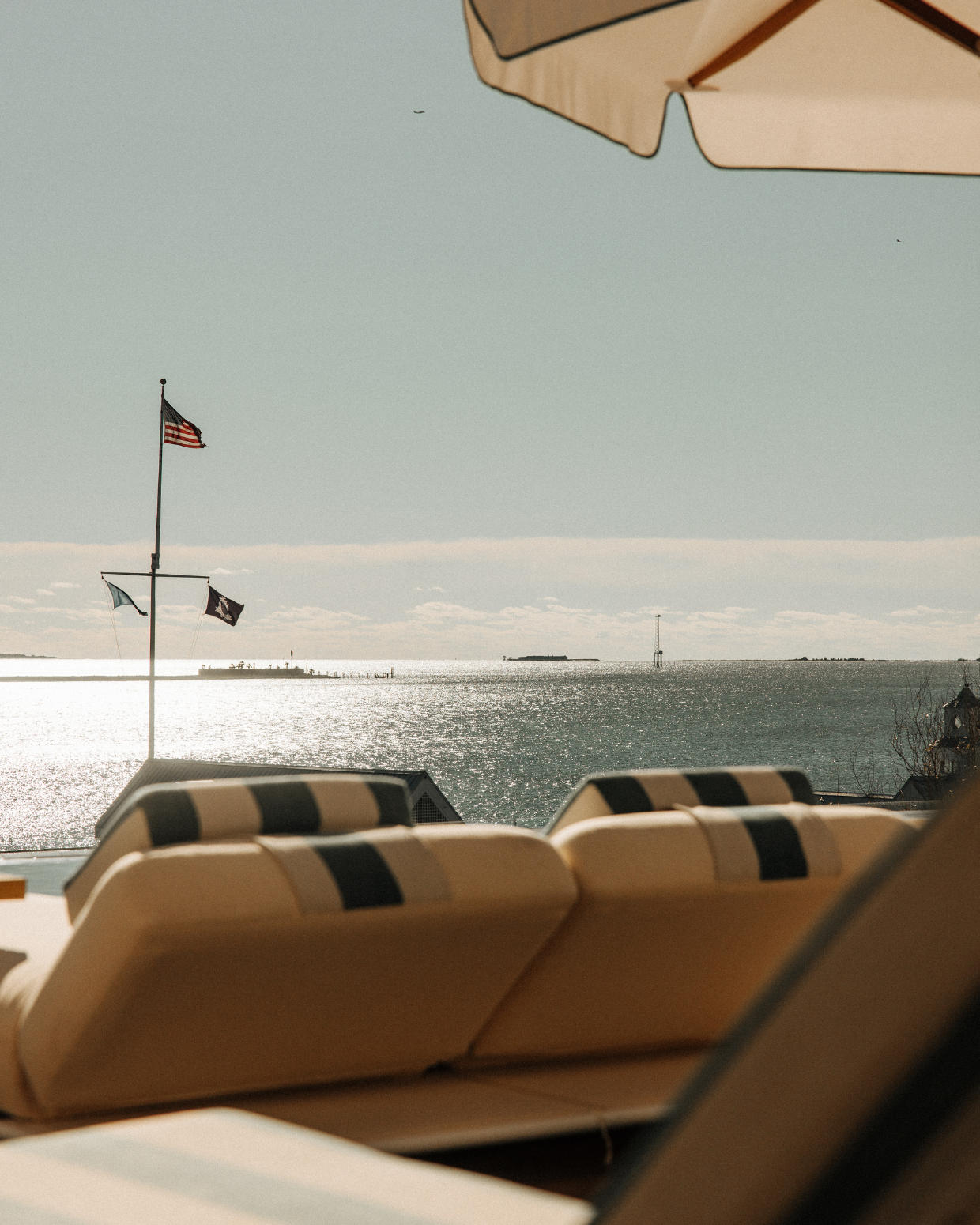 Image of pool lounger over looking harbor