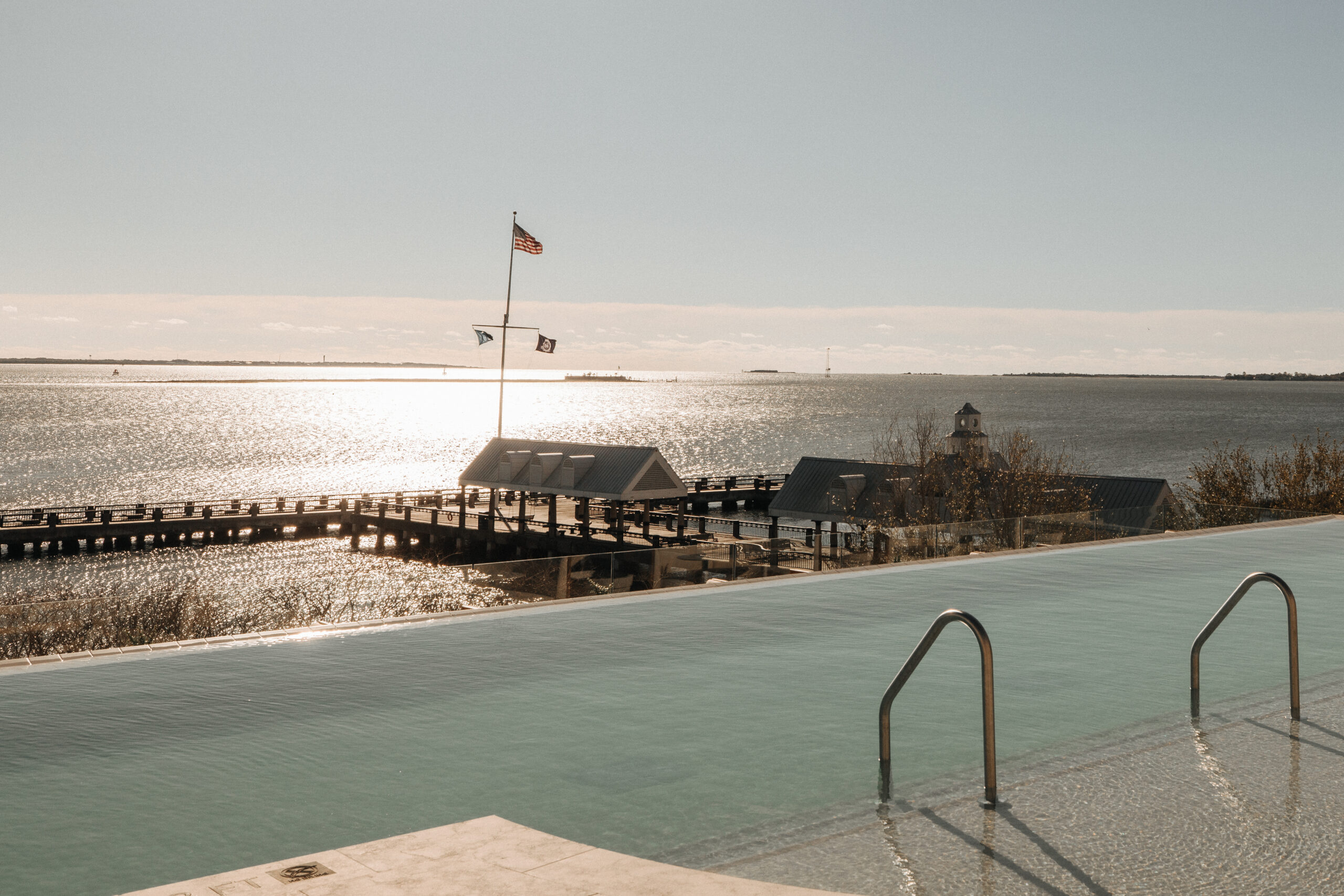 Image of the rooftop pool looking over the Charleston Harbor