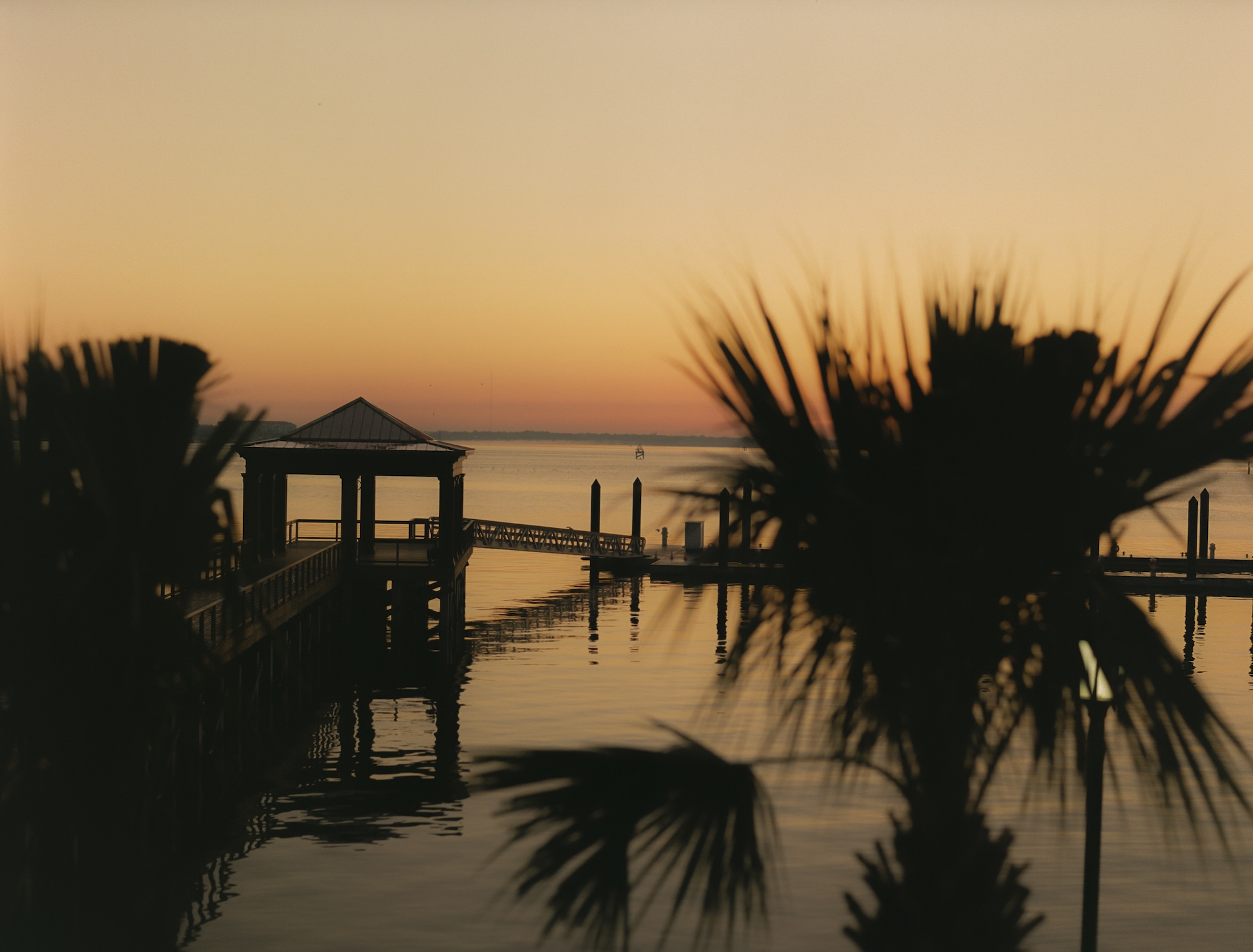 Image of the sunset over The Marina dock at The Cooper